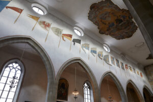 The Franciscan church in Lucerne, the left wall of the central nave displays paintings done after 1622 of the original captured flags from the victorious federal battles.