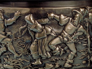 Darstellung eines Bauerntanzes auf einer Spanischsuppenschüssel aus der Glocken- und Geschützgiesserei Füssli. Zürich, um 1600. Bronze.