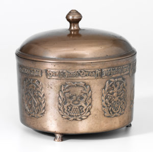 Spanish soup tureen. Cylindrical on three low feet. Smooth sides with three coats of arms in relief. From the former Herrenstube, now the Zunft zum Kleeblatt guild, in Stein am Rhein. 1614.