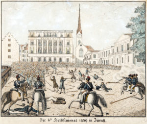 Les combats entre les troupes du gouvernement (à cheval) et les paysans insurgés font rage sur la Paradeplatz, derrière l’hôtel « Baur en Ville » et la Fraumünster.
