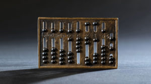 The Romans developed a hand-held abacus out of the old abacus. Riveted studs replaced the loose stones, making the device light and portable.