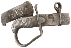 Fingerring aus Stahl in der Form eines Kavalleriesäbels mit der Inschrift «hergestellt aus Blücher-Reitersäbeln v. 1813», 1813 - 1819.