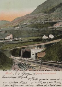 The entrance to the Gotthard tunnel in Airolo on a colourised postcard from 1893.