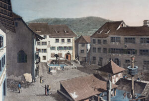 Der Bäderplatz in Baden mit den öffentlichen Bädern, dem Freibad im Hintergrund und dem St. Verenabad vorne; hier verbrachten die einfacheren und bedürftigen Gäste ihren Badeaufenthalt. Aquatinta Heinrich Keller 1805.