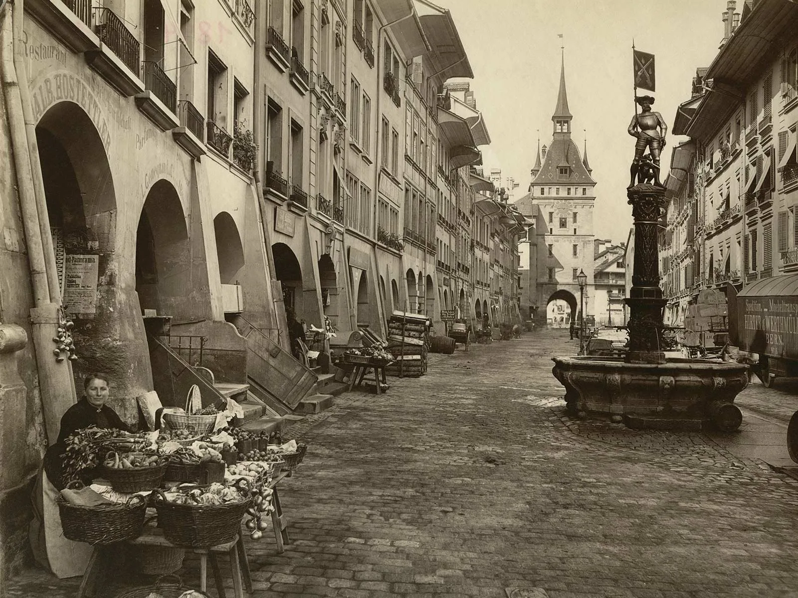 Marktgasse in Bern, photographed in 1894. The gas lamps (centre of the picture), which lit the street at the time, are clearly visible.