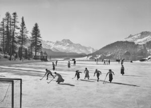 Women and men at a bandy game, St. Moritz, 1910.