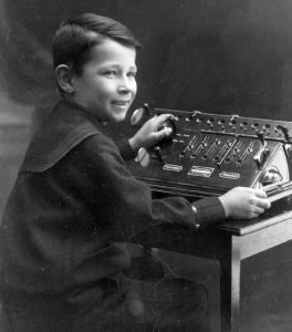Curt Herzstark at the age of 8 using an Austria Model III during the International Office Exhibition in Vienna in 1910.