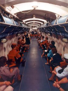 The interior of the submarine, with armchairs and screens.