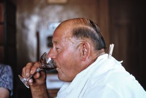 Alcohol was long considered good for health. A man drinking wine, c. 1964.