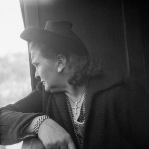 A woman riding on the Fribourg funicular, 1949.