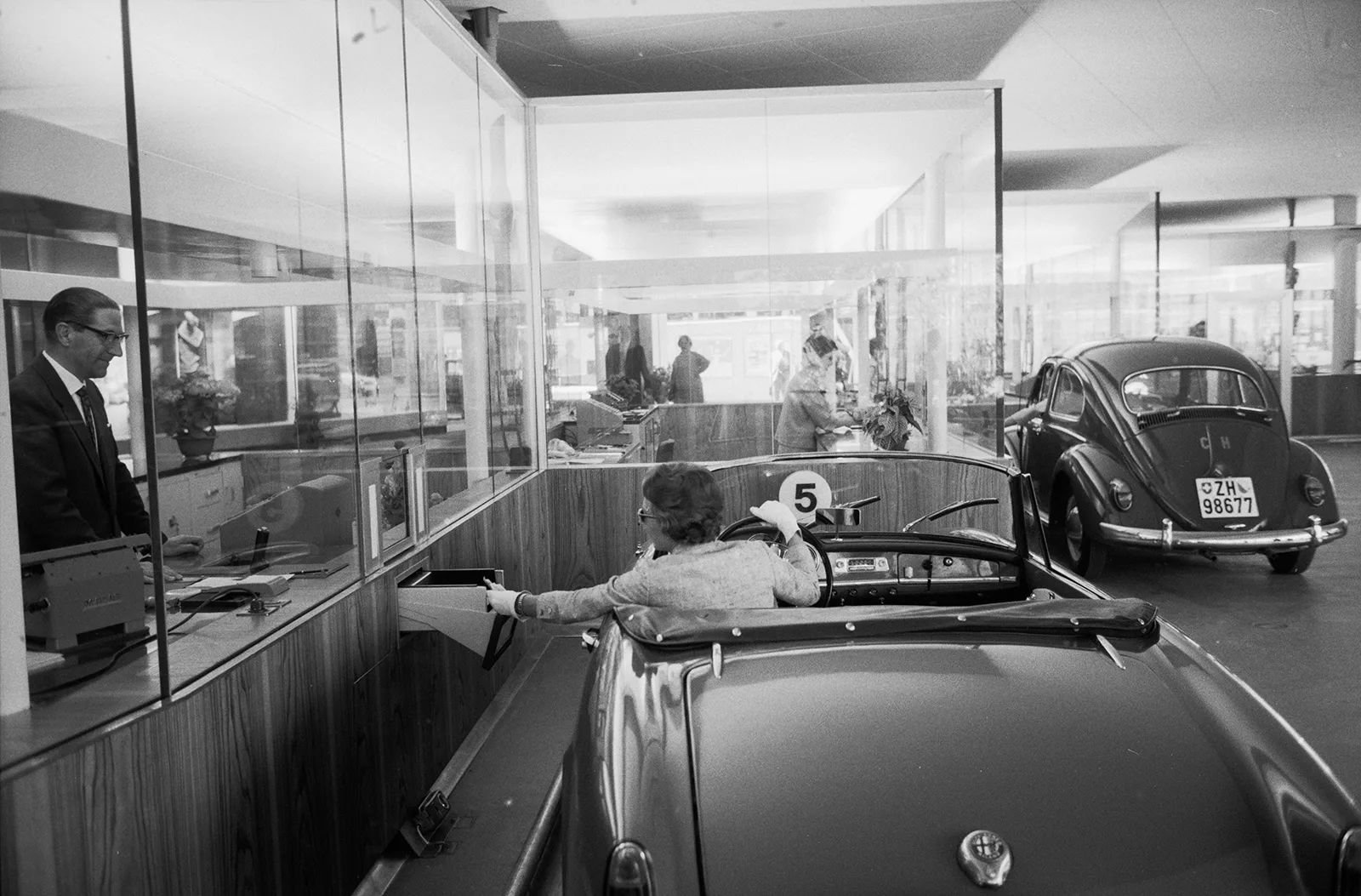 A customer at the Schweizerische Kreditanstalt’s drive-in bank on St. Peter-Strasse in Zurich, 1962.