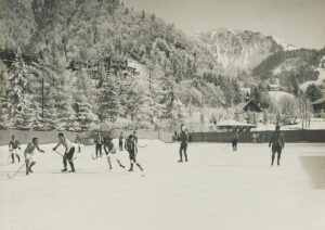 Elegant ice hockey game in the Grand Hotel at Les Avants, canton of Vaud in the 1920s.