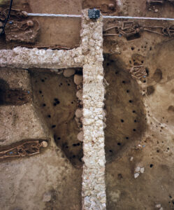 Remains of walls of the ‘priest’s house’ with children’s skeletons, discovered during excavations.
