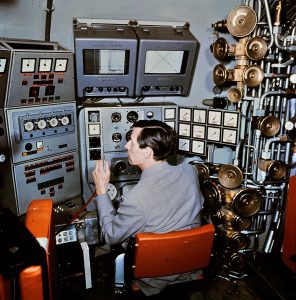 Jacques Piccard in the cockpit of the Mésoscaphe, April 1964.