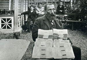 Franz Josef Bucher with his famous Genoa millions. His wife Josefina Durrer and two sons Ernst and Werner can be seen in the background. 1894.