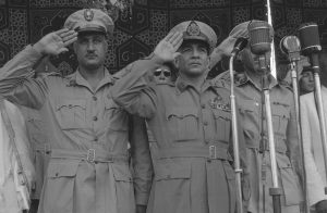 Gamal Abdel Nasser (left) in a 1955 photo.