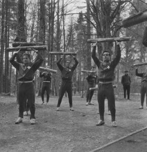 The Swiss national football team training in the woods, circa 1960.
