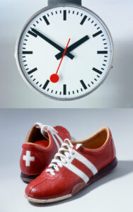 Station clock and Micheline Calmy-Rey’s shoes: symbols of punctuality and diplomacy, two “typical” Swiss characteristics.