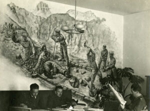 Salle de séjour des internés polonais dans le camp universitaire de Winterthour. La fresque murale, qui montre une scène de travaux dans le Safiental, a aujourd’hui disparu.